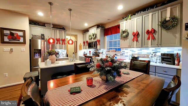 dining area with dark hardwood / wood-style floors