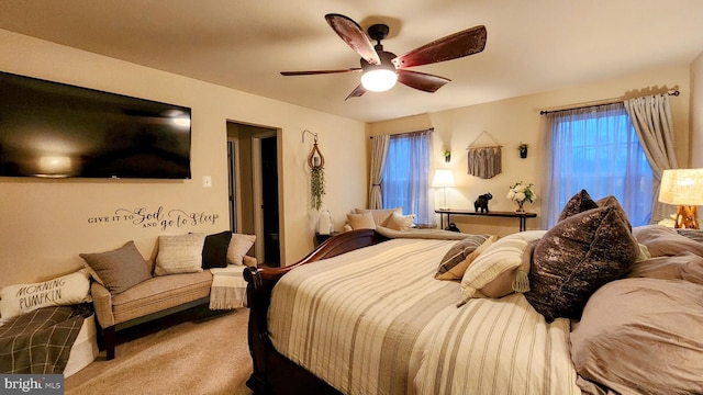 carpeted bedroom with ceiling fan