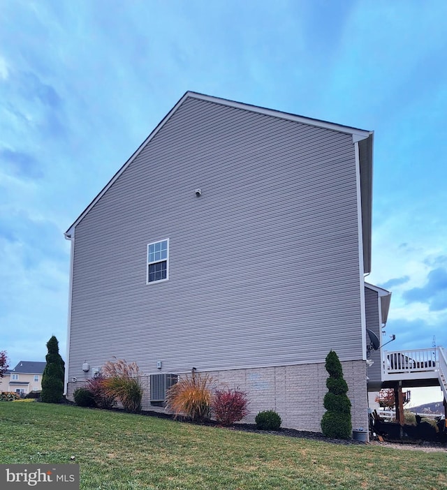 view of property exterior featuring a yard