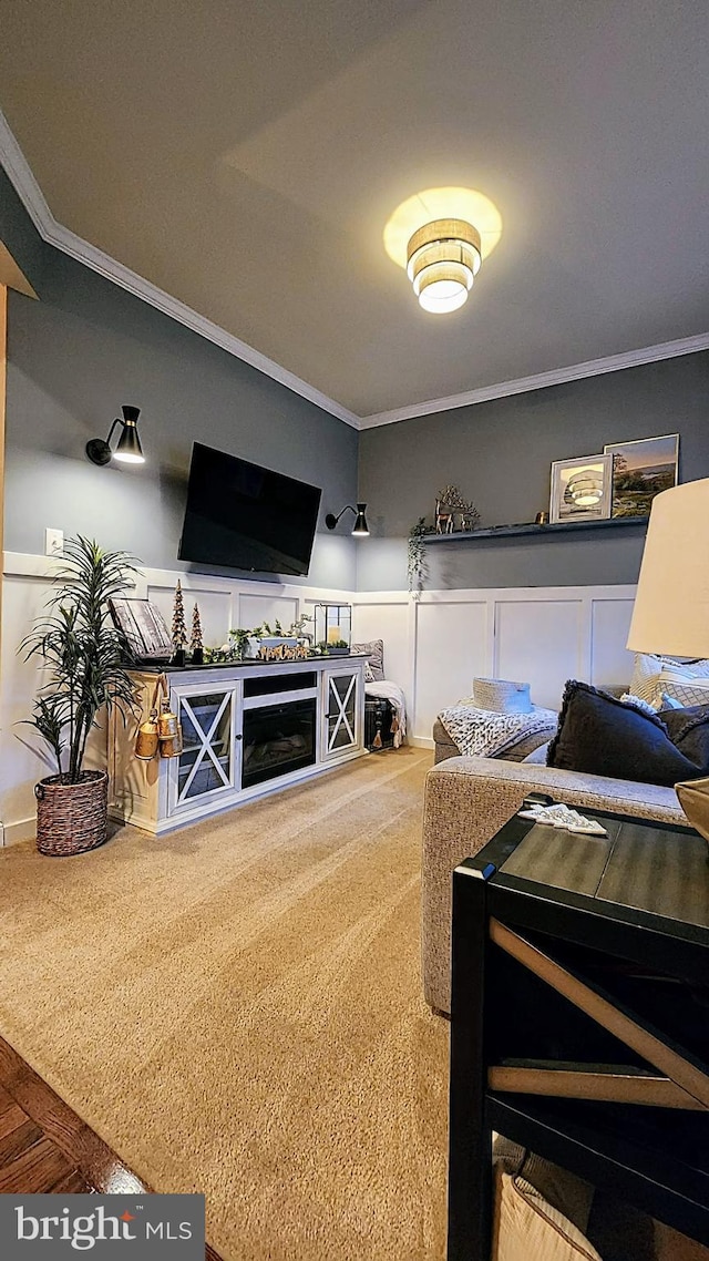 living room with crown molding and carpet flooring