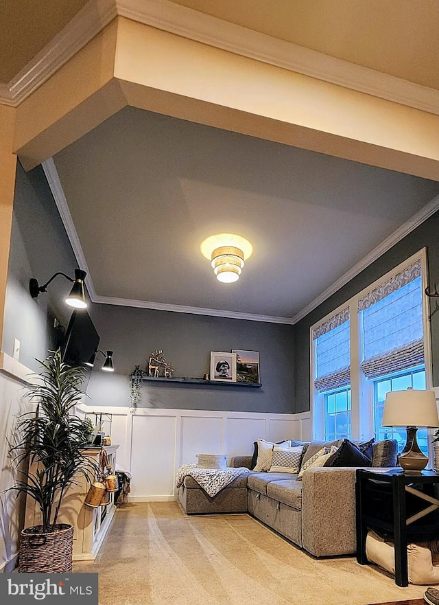 living room with crown molding and light colored carpet