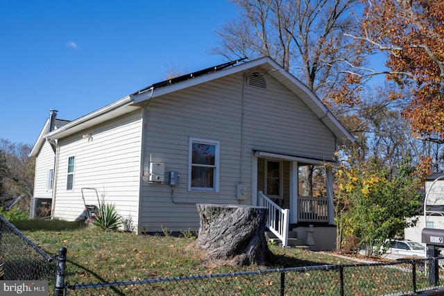 back of house featuring covered porch