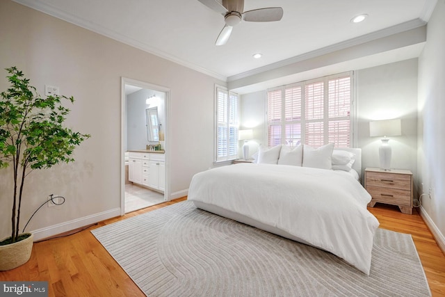 bedroom with ornamental molding, light wood-type flooring, ceiling fan, and connected bathroom