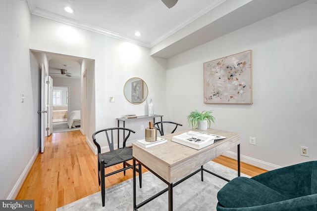 office area with light hardwood / wood-style floors, ceiling fan, and crown molding