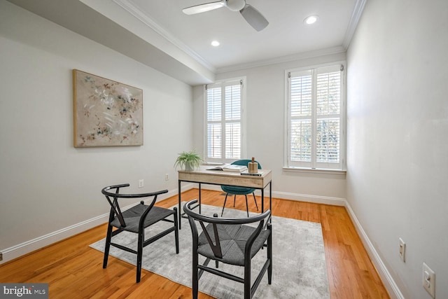 office area with ceiling fan, wood-type flooring, and crown molding