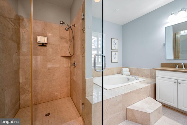 bathroom with vanity, tile patterned flooring, and plus walk in shower