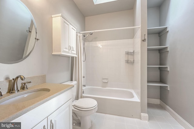 full bathroom featuring tile patterned floors, vanity, toilet, shower / tub combo with curtain, and a skylight