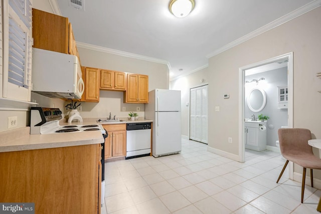 kitchen with crown molding, sink, white appliances, and light tile patterned floors