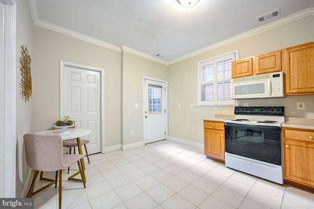 kitchen with ornamental molding, light tile patterned flooring, and white appliances