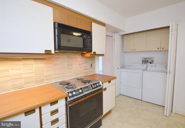 kitchen featuring tasteful backsplash, electric stove, light floors, washing machine and dryer, and black microwave