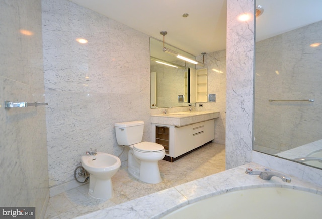 full bathroom with a bidet, vanity, and toilet