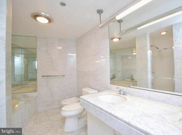 full bathroom with a tub to relax in, a shower, tile walls, toilet, and vanity