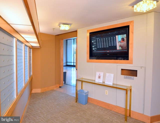 interior space with baseboards and mail area