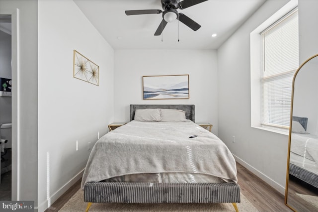 bedroom featuring ceiling fan and hardwood / wood-style floors