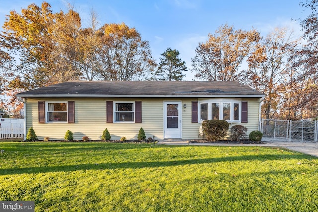 ranch-style home with a front yard