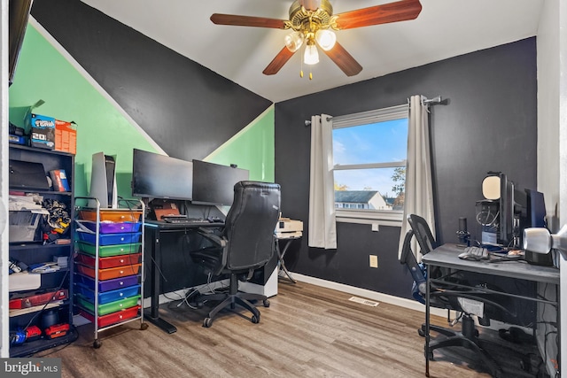 office featuring hardwood / wood-style floors and ceiling fan