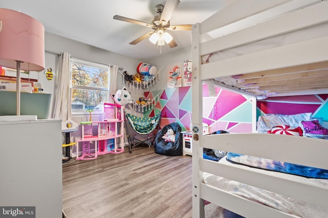 bedroom with hardwood / wood-style flooring and ceiling fan