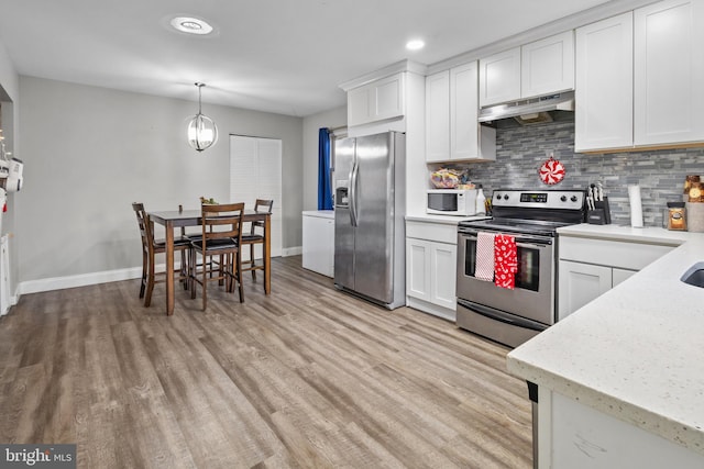 kitchen featuring stainless steel appliances, light hardwood / wood-style floors, white cabinets, backsplash, and pendant lighting