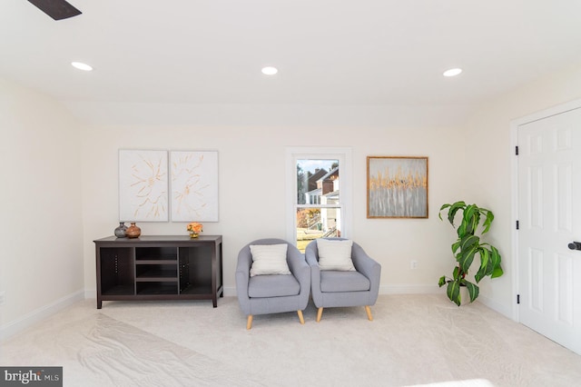 sitting room with light colored carpet