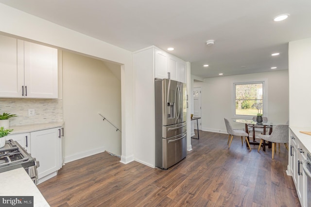 kitchen featuring white cabinetry, dark hardwood / wood-style floors, and stainless steel appliances