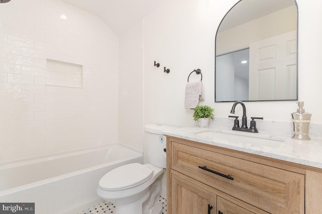 full bathroom featuring lofted ceiling, tile patterned floors, toilet, vanity, and shower / bathtub combination