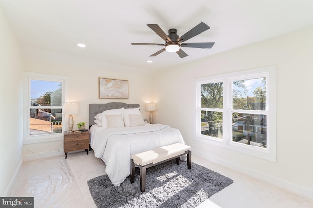 carpeted bedroom featuring ceiling fan