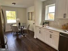 dining space featuring dark hardwood / wood-style floors