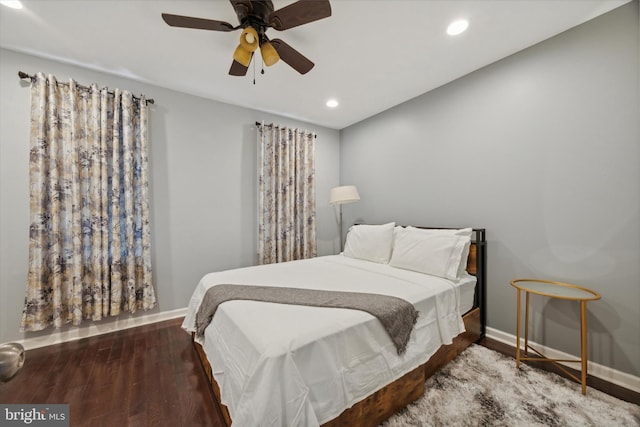 bedroom featuring ceiling fan and dark hardwood / wood-style floors