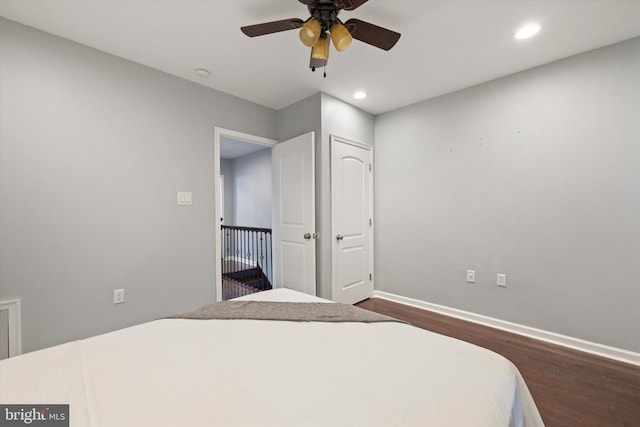 bedroom featuring ceiling fan and dark wood-type flooring