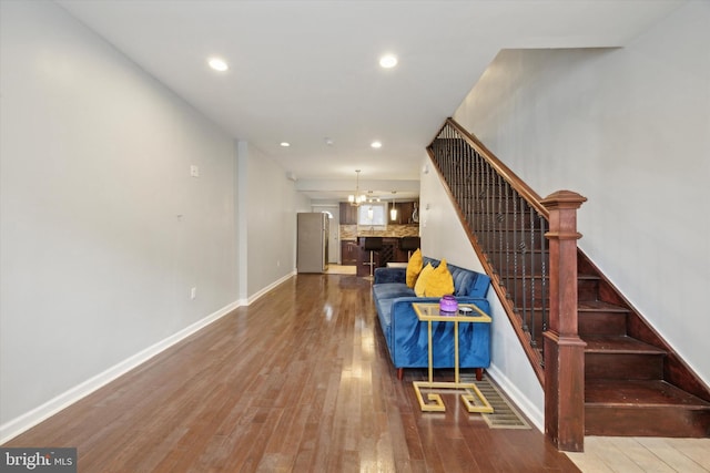 staircase with wood-type flooring