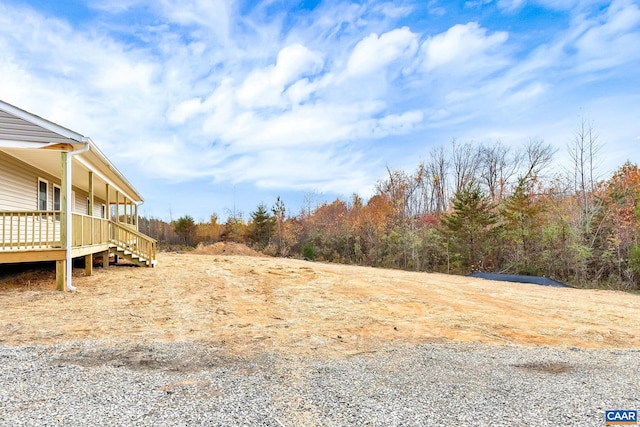 view of yard with a wooden deck