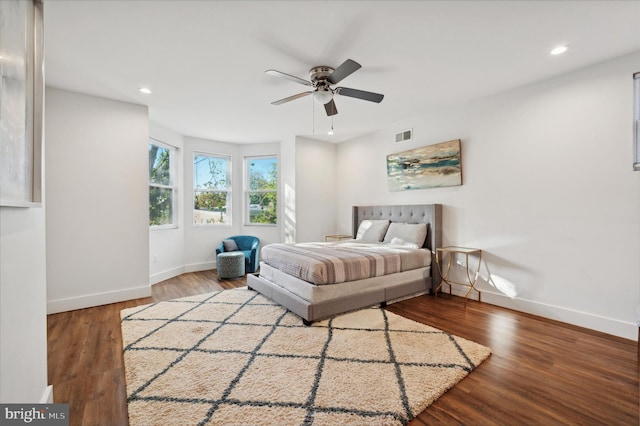 bedroom with ceiling fan and wood-type flooring