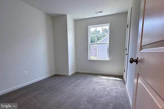 unfurnished room with carpet floors