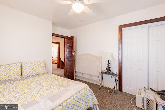 carpeted bedroom with a closet and ceiling fan