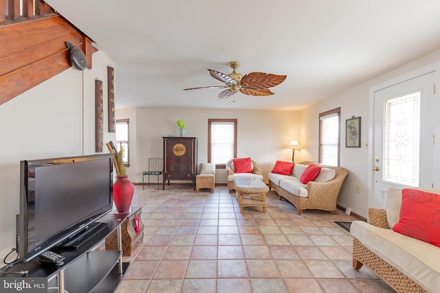 tiled living room featuring ceiling fan