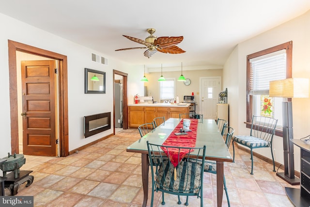 dining area with ceiling fan