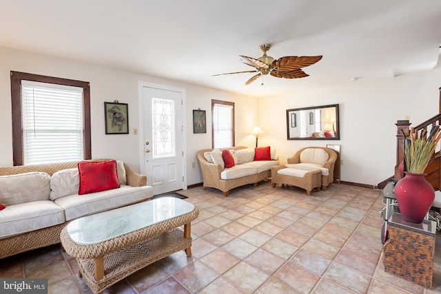 living room with light tile patterned flooring and ceiling fan