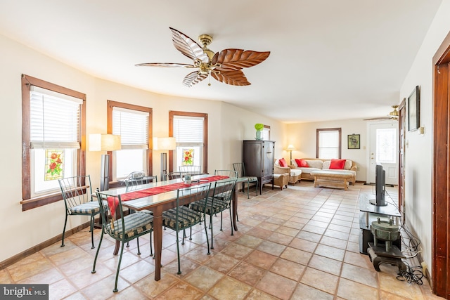 dining space featuring ceiling fan and a healthy amount of sunlight