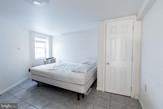 bedroom with light tile patterned floors