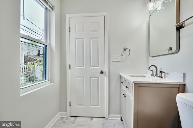 1341 Sargeant St, Baltimore, MD 21223 - bathroom featuring baseboards, toilet, and vanity