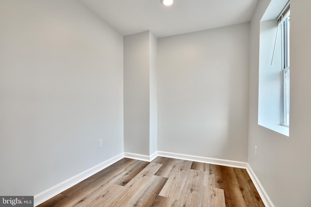 spare room with light hardwood / wood-style flooring