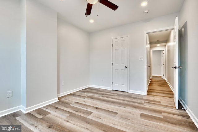 unfurnished bedroom with a closet, ceiling fan, and light hardwood / wood-style floors