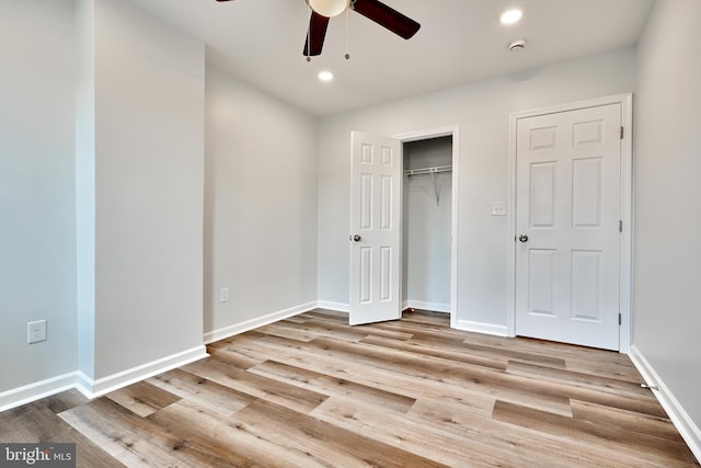 unfurnished bedroom with a closet, ceiling fan, and light hardwood / wood-style flooring