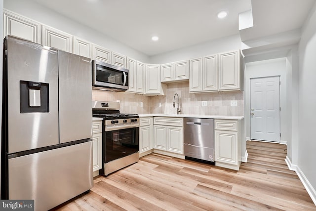 1341 Sargeant St, Baltimore, MD 21223 - kitchen with stainless steel appliances, light wood-type flooring, light countertops, and recessed lighting
