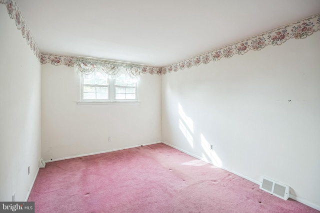 empty room featuring carpet flooring