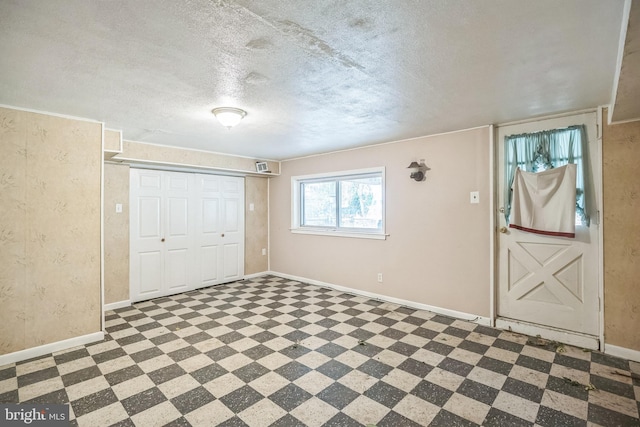 entryway featuring a textured ceiling