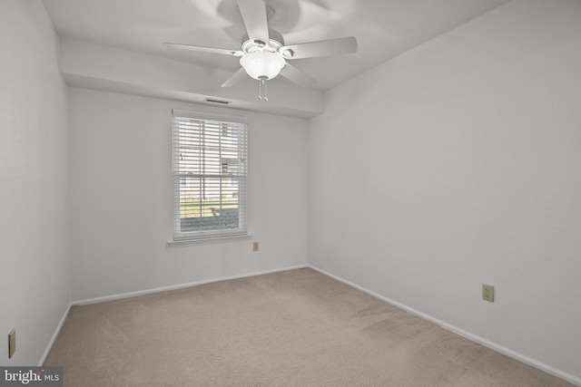 carpeted empty room with ceiling fan