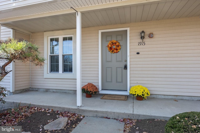 entrance to property with covered porch