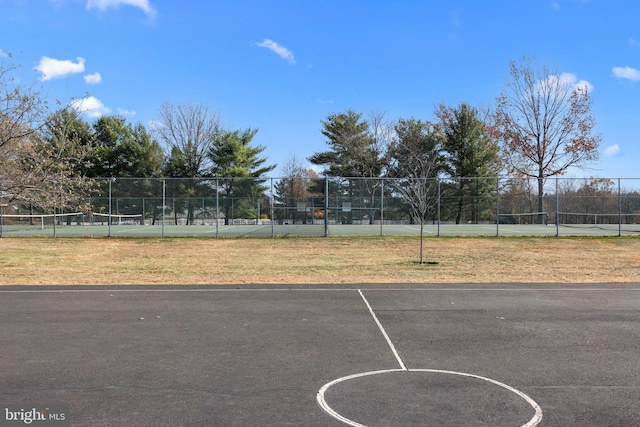 view of basketball court with tennis court