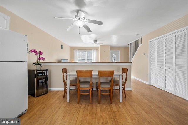 dining area featuring light hardwood / wood-style floors and ceiling fan